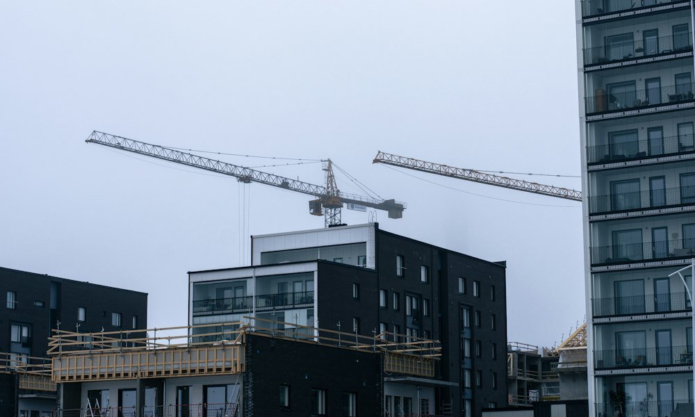 Construction crane working on an apartment building retrofit