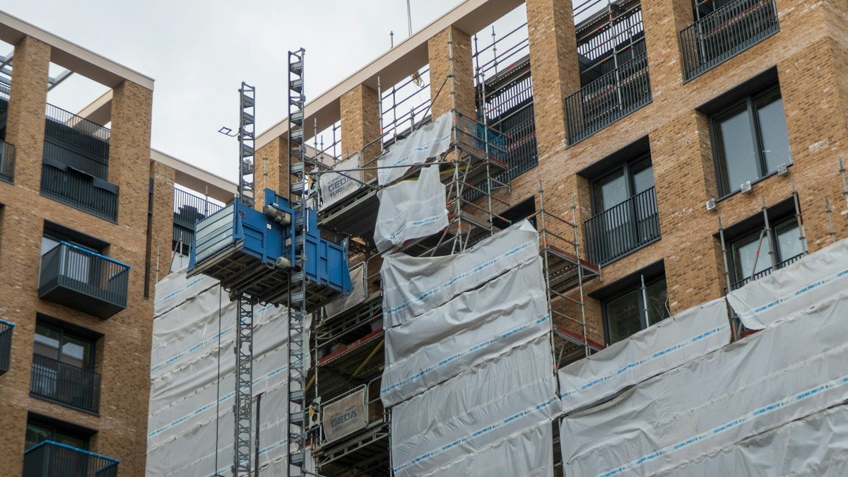 Apartment building undergoing seismic retrofit work with scaffolding